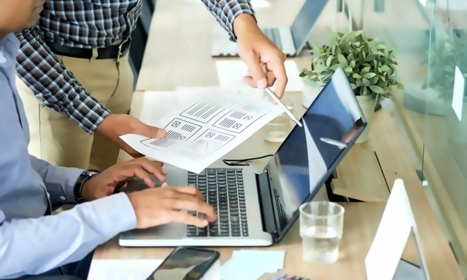 Modern mobile app development workspace with design tools and testing devices